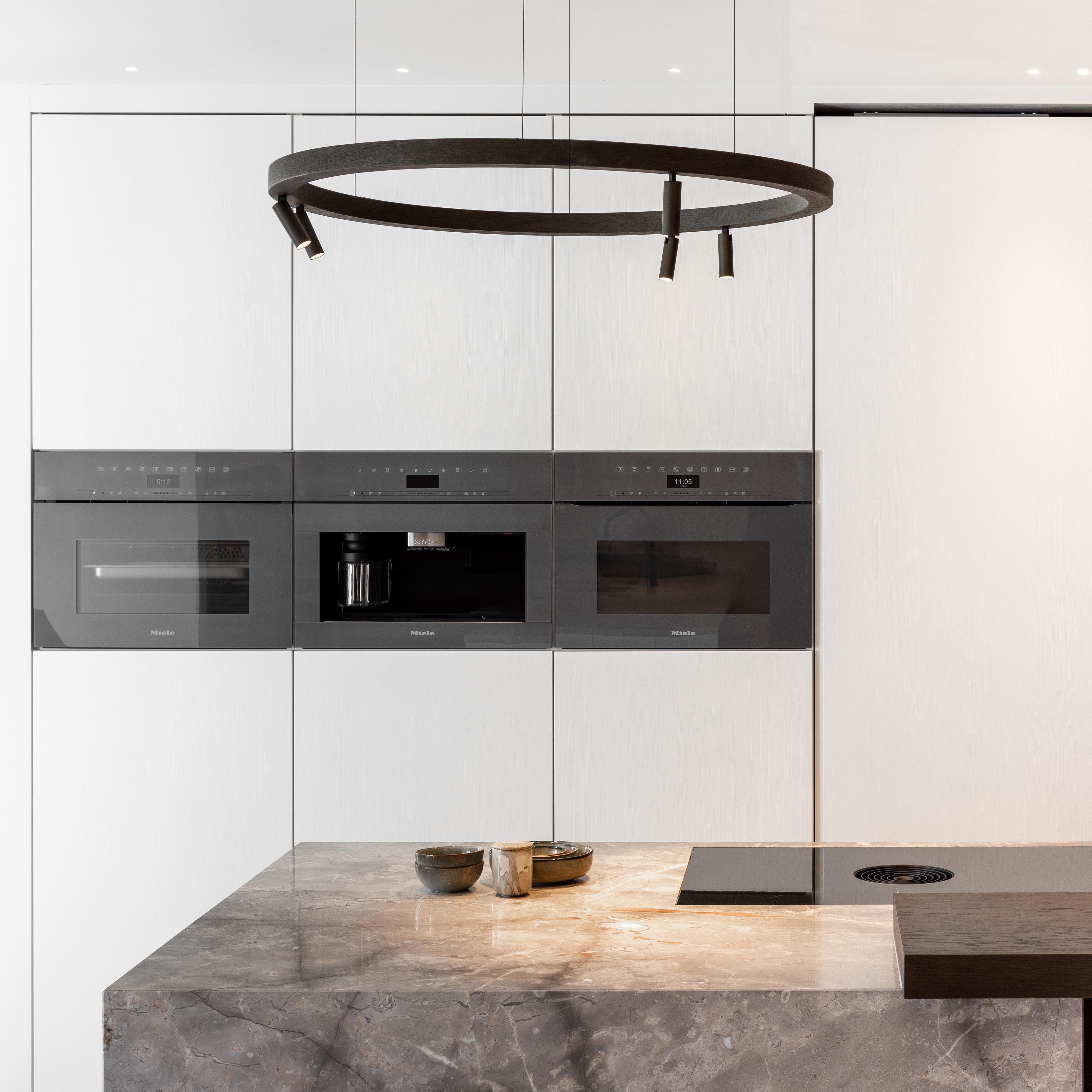 wood circle pendant 200cent Brick in the Wall