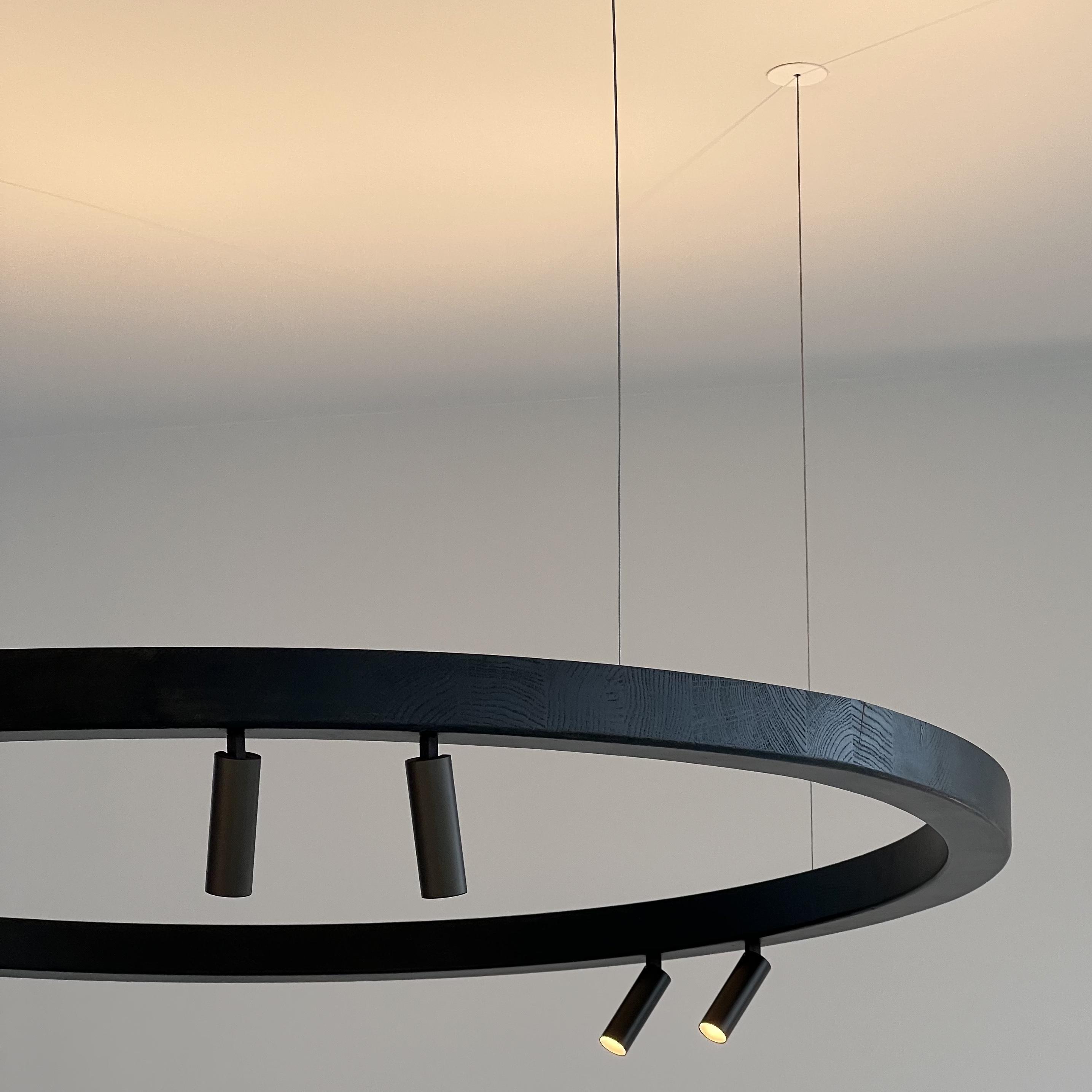 wood circle pendant 200cent Brick in the Wall